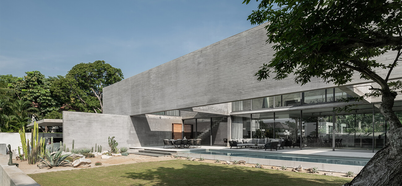 Ngôi biệt thự 2 tầng hiện đại mát lạnh với khối bê tông trần đồ sộ